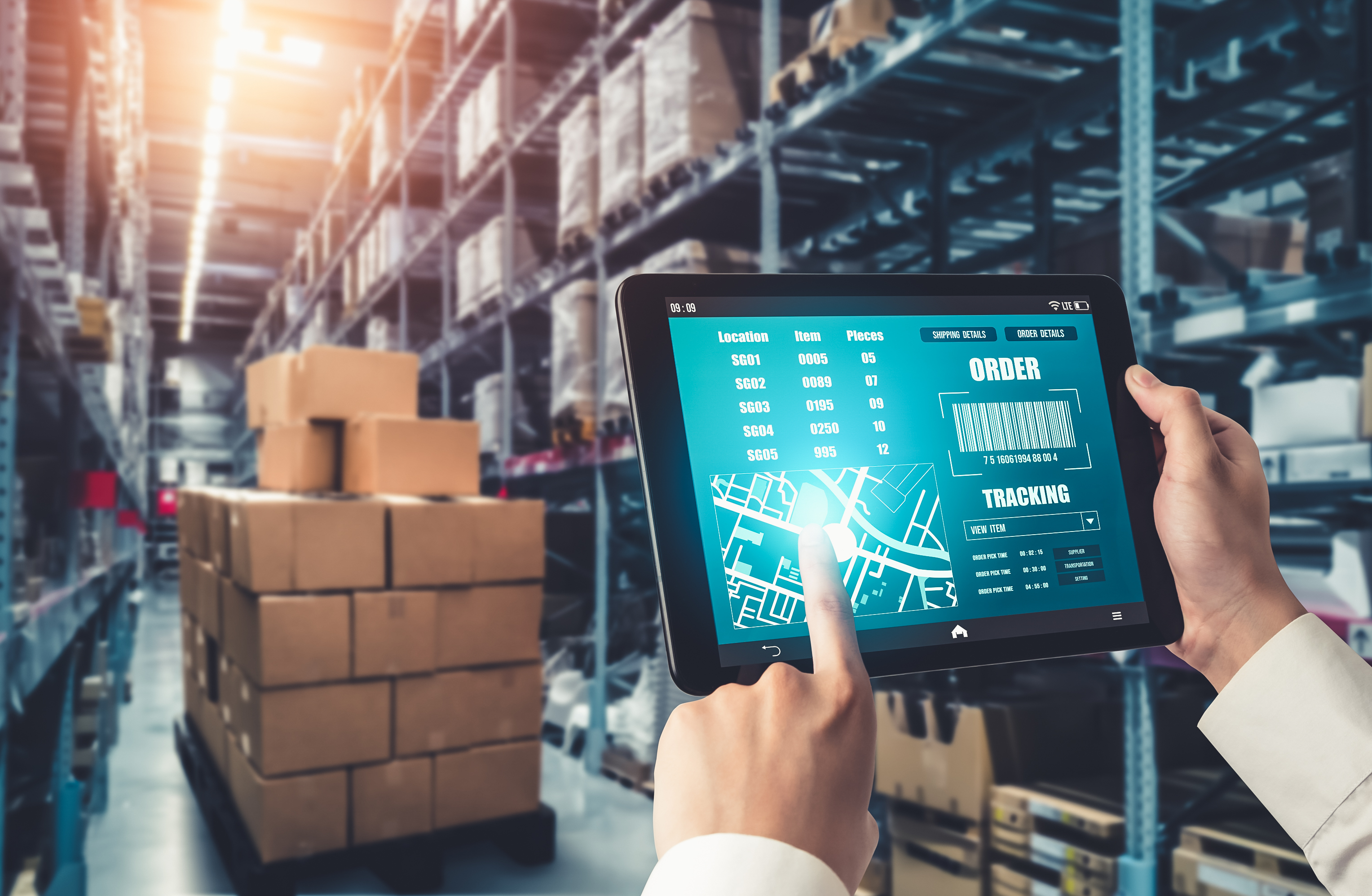 A freight agent checking orders in the warehouse using My cargo Agent Freight management system
